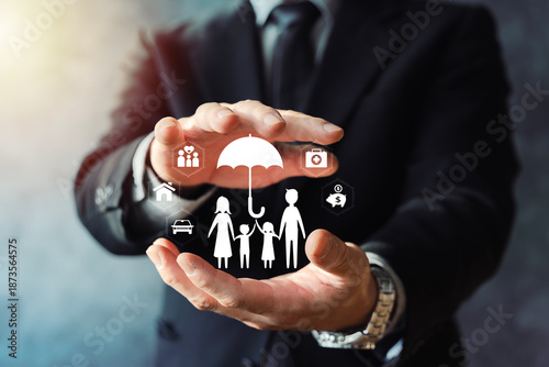Quadro em tela Family Insurance Protection Concept with Umbrella and Businessman Hands