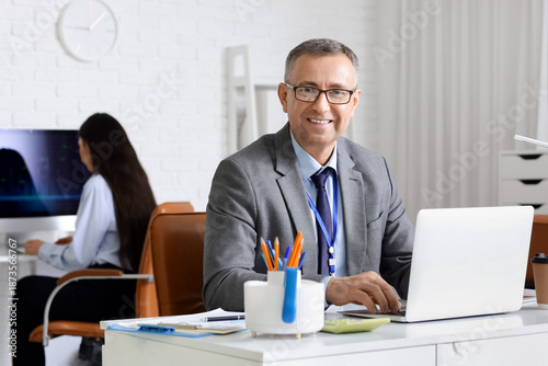 Male business analyst worki...