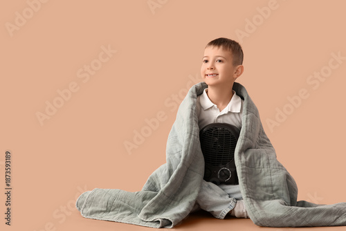 Little boy with blanket and...
