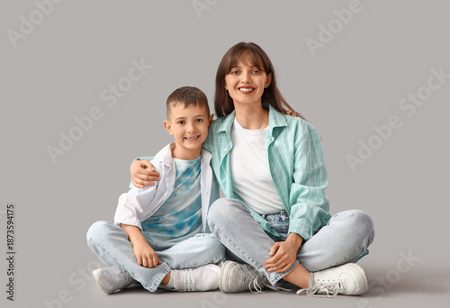 Happy mother hugging her li...