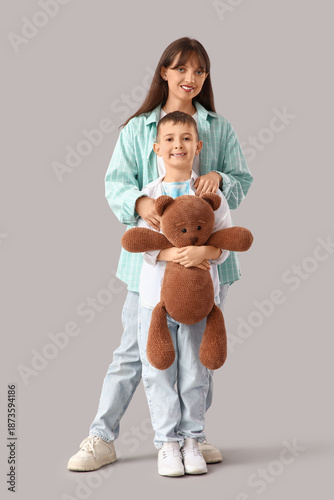Happy mother hugging her li...