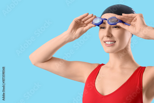 Young female swimmer with g...