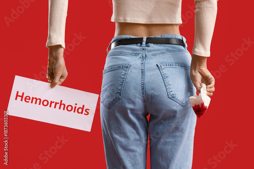 Young woman holding paper w...