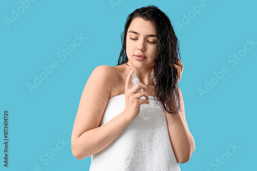 Young woman applying hair s...