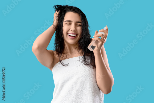 Happy young woman with hair...
