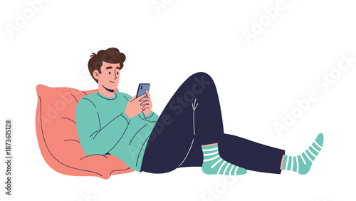 Young man relaxing on a large coral pillow while browsing on his smartphone with casual clothes and striped socks.
