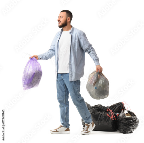 Young man with garbage bags...
