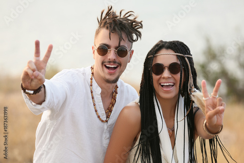 Young couple of hippies wit...