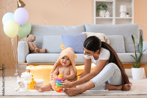 Young woman and her baby in...