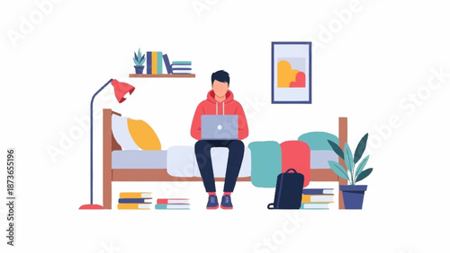 Young man in a red hoodie sitting on his bed, working or studying on a laptop in a modern room.