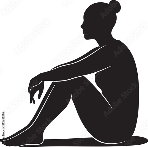 Silhouette of a woman sitting in a contemplative pose