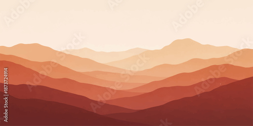 Sunrise over the misty mountain landscape with a silhouette of hills and forest in the blue fog