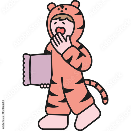 Child in Tiger Pajamas Yawning While Holding a Book