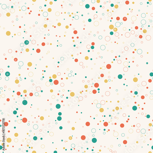Playful seamless pattern with teal, yellow, and red circles on a cream background