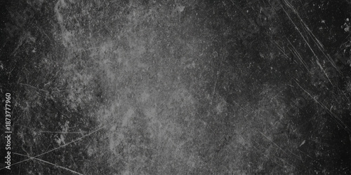 A dark textured background featuring prominent scratches and subtle grain creating an aged and distressed aesthetic
