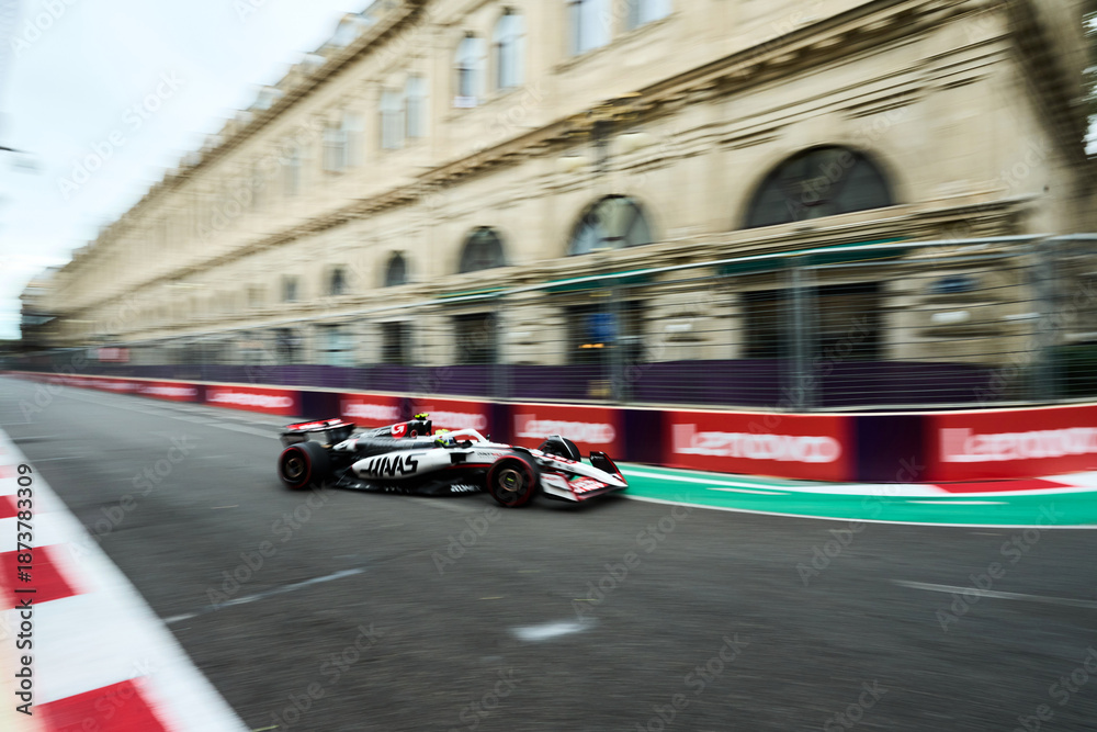 Fototapeta premium BAKU, AZERBAIJAN - SEPTEMBER 20, 2025: Nico Hulkenberg drives the MoneyGram Haas F1 Team car during the Azerbaijan Grand Prix.
