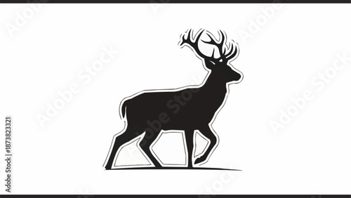 Silhouette of a majestic stag with large antlers walking.