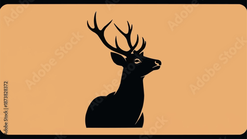 Silhouette of a majestic stag with large antlers against a warm orange background.