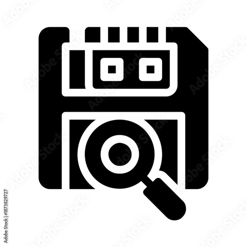 Floppy disk and magnifying glass for data recovery or tech concepts. Vintage storage media for retro nostalgia or technology design.

