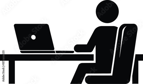 Silhouette of person working at laptop computer on desk