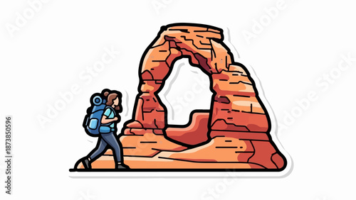 Hiker approaches a majestic sandstone arch