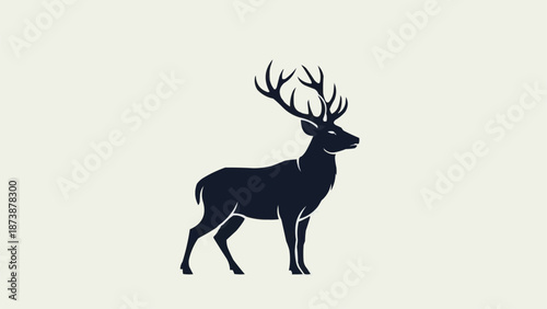 Majestic Stag Silhouette Standing Proudly Against A Light Background.