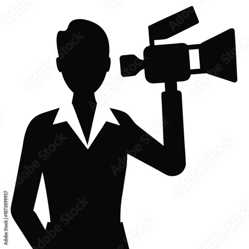 Silhouette of a person holding a video camera professional recording an event