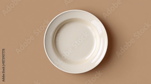 Simple, elegant bone china plate with concentric rings sits on a neutral taupe backdrop. The clean lines and minimalist design create a calm, inviting aesthetic. Very Chic.