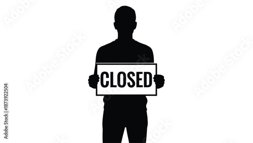 Silhouette of a person holding a sign that reads closed