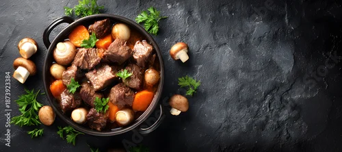 Panel kuchenny z motywem Hearty beef stew brimming with tender meat, sweet carrots, earthy mushrooms, and fragrant herbs. A comforting dish perfect for chilly evenings, served on a dark, rustic surface.