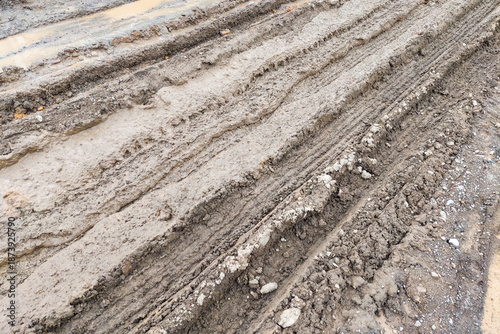 The texture of the road is muddy and mixed with old dirt.