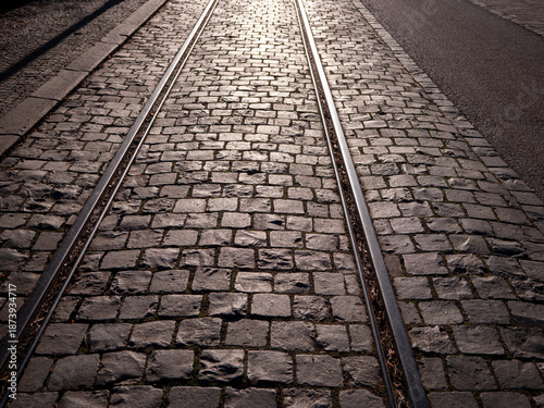 Φωτογραφία Tram tracks embedded in cobblestone street in historic old town