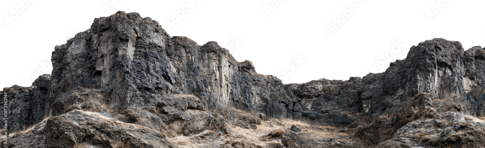 Naklejka premium Jagged, rocky mountain range against a stark black background, showcasing weathered surfaces