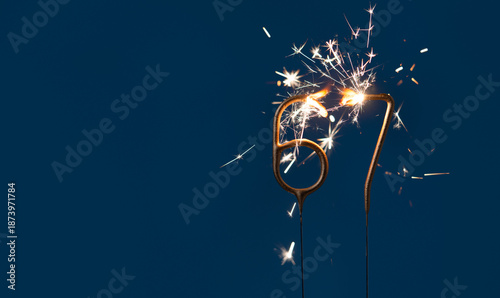 Valokuva 67 years anniversary celebration festive background made with Bengal fires in the form of number Sixty seven