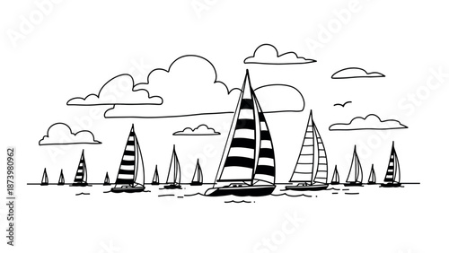 Black and white sailing boats with striped sails on a calm sea