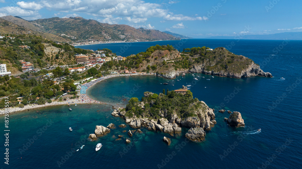 Obraz premium Aerial view of Isola Bella, a tidal island located on the eastern coast of Sicily, in province of Messina, Italy. It's a wonderful summer tourist destination.On the horizon, it's the Mediterranean Sea