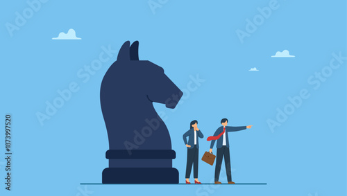 Businessman leader pointing the direction with his colleague thinking and knight chess. Business strategy, leadership and skill to solve business problem, make decision to achieve target.