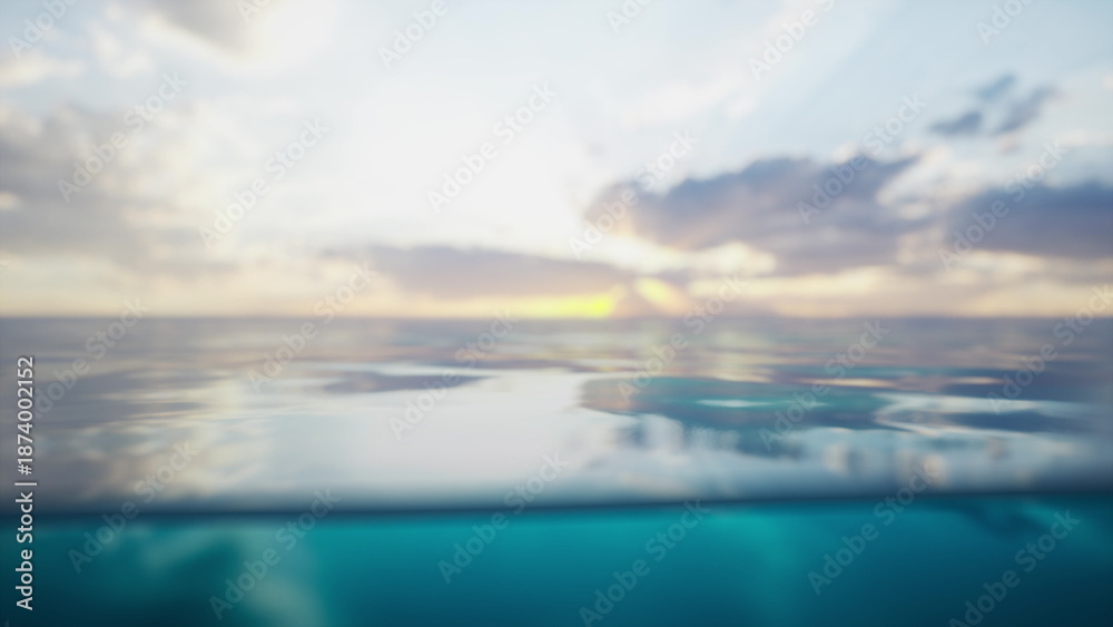 Obraz premium Soft waves gently ripple on the ocean surface as the sun sets in the distance. The sky glows with hues of orange and pink, creating a serene atmosphere at twilight.
