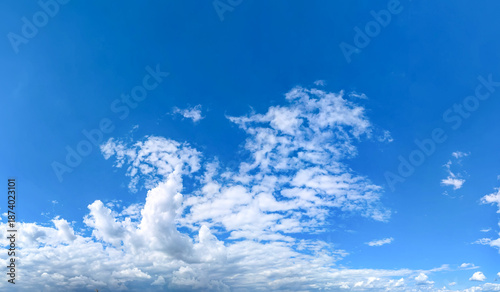 Fotografie A raster image of a some cloud photographed against a blue sky