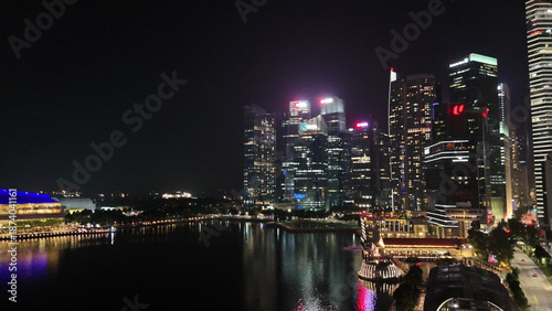 Photography Stunning aerial nighttime panorama featuring the Merlion statue, Jubilee Bridge,