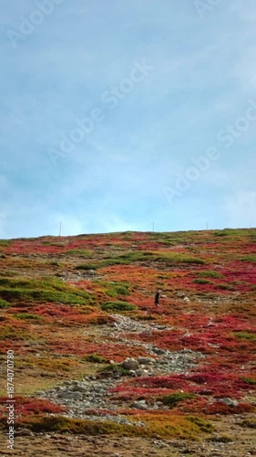 A person walking up a hill in the Balkan mountains