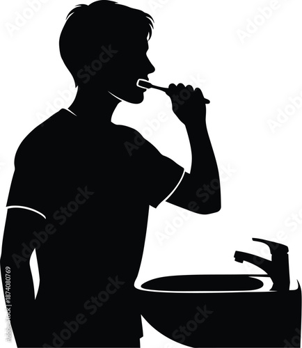 Silhouette of a young man brushing his teeth while standing at a bathroom sink with a modern faucet illustrating daily personal hygiene routine
