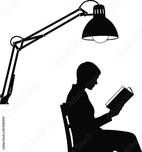 Silhouette of a person sitting under a focused desk lamp reading an open book in the quiet solitude of a well-lit study area