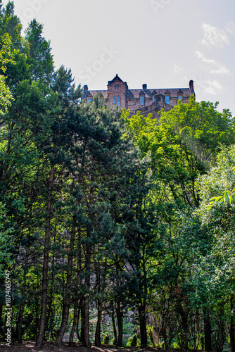 Scotland, United Kingdom: glimpse of Edinburgh Castle, served in history as royal residence, arsenal, prison and home of Honours of Scotland,  seen from West Princes Street Gardens public parks