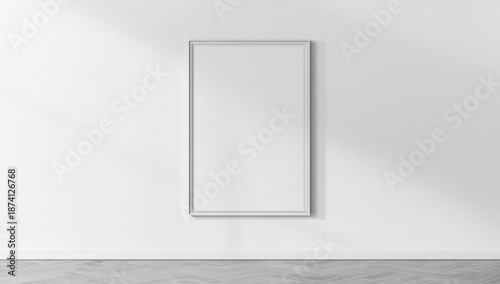 Wall-mounted blank poster with smooth surface, used as background for layout or graphic design, interior decor