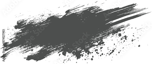 Dark gray abstract brush stroke with splattered ink effect on a white background, conveying a raw and energetic artistic expression