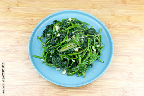 The stir-fried sweet potato leaves on the plate