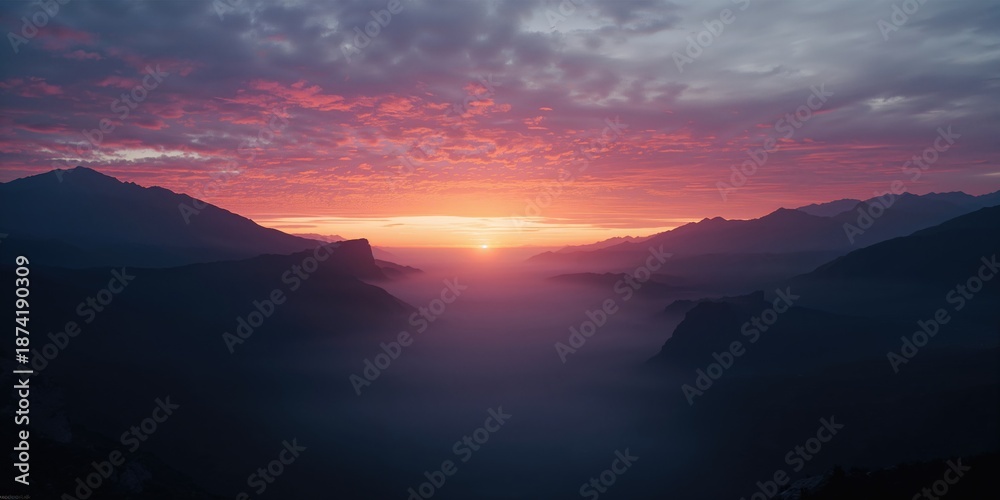 Fototapeta premium Dusk illuminates mountainous terrain with fog settling in the valley, highlighting erosion risk