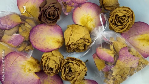 Organza sachets filled with dry rose petals, rose flower heads, natural air fresheners, top view