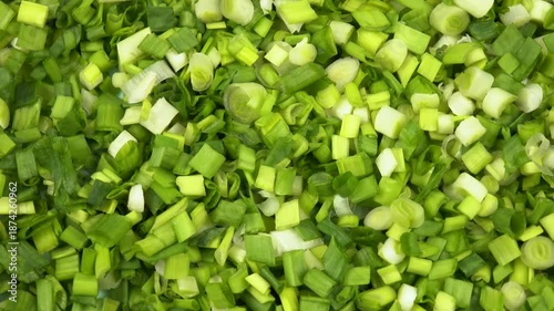 Finely chopped green onions, top view, natural background